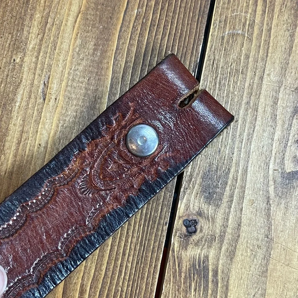 Brown leather belt with embossed design